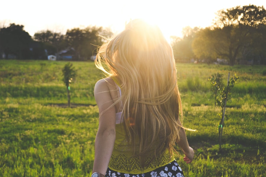  A Girl With Long Hair Running In A Field 
