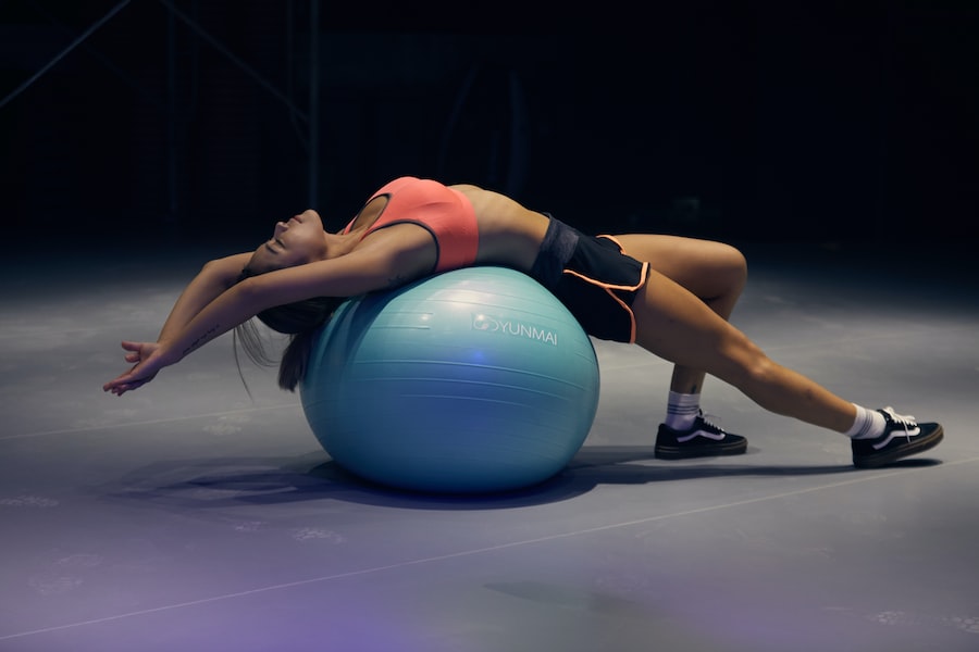  A Woman Lying On A Blue Ball 